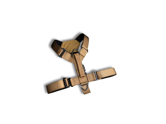 Tan dog harness on a white background